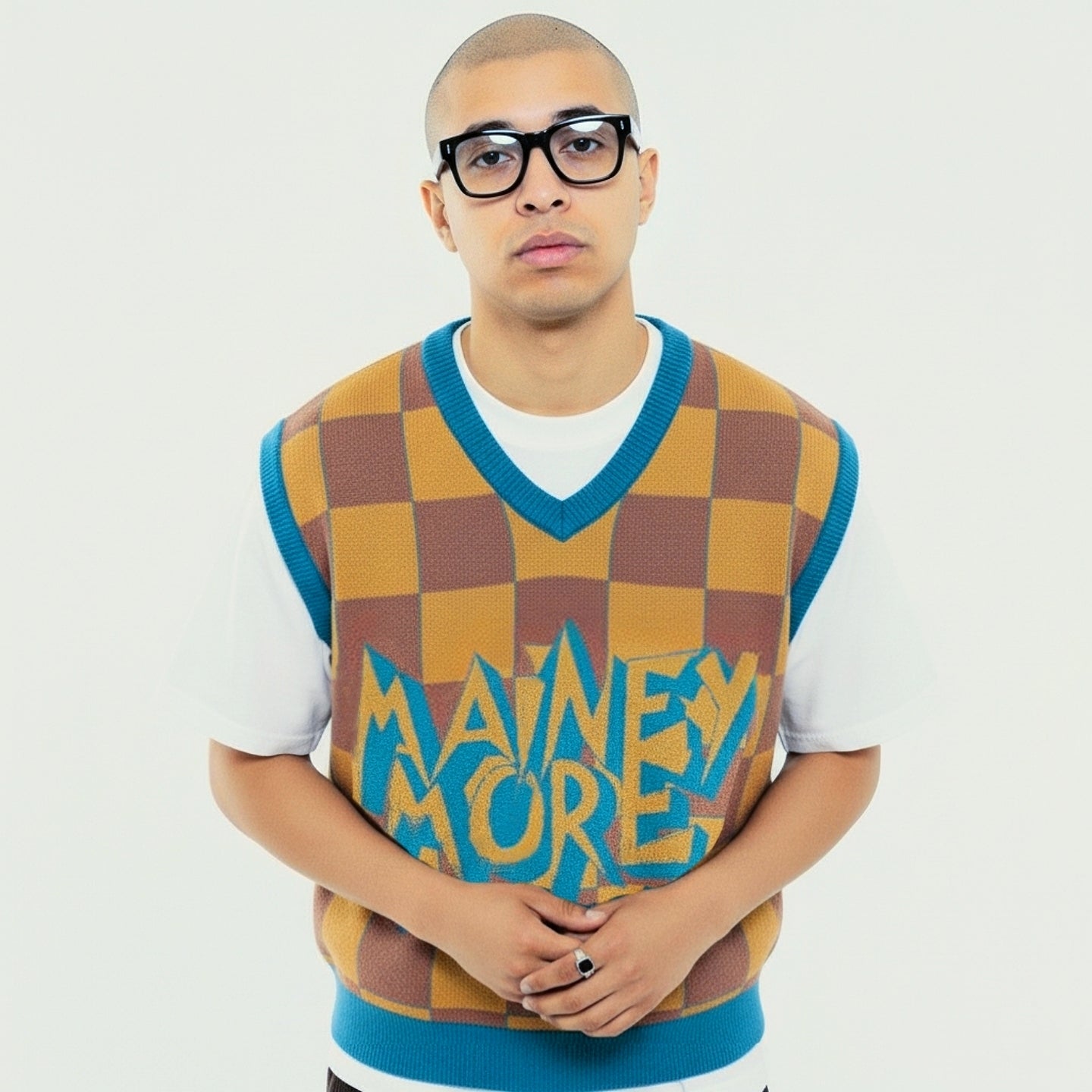MAINEY MORE knit vest with yellow-brown checkerboard pattern, teal details, and bold graffiti logo