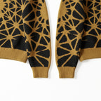 Sophisticated knit pullover with large-scale gold and black line ornament, drawing from modern streetwear and art.