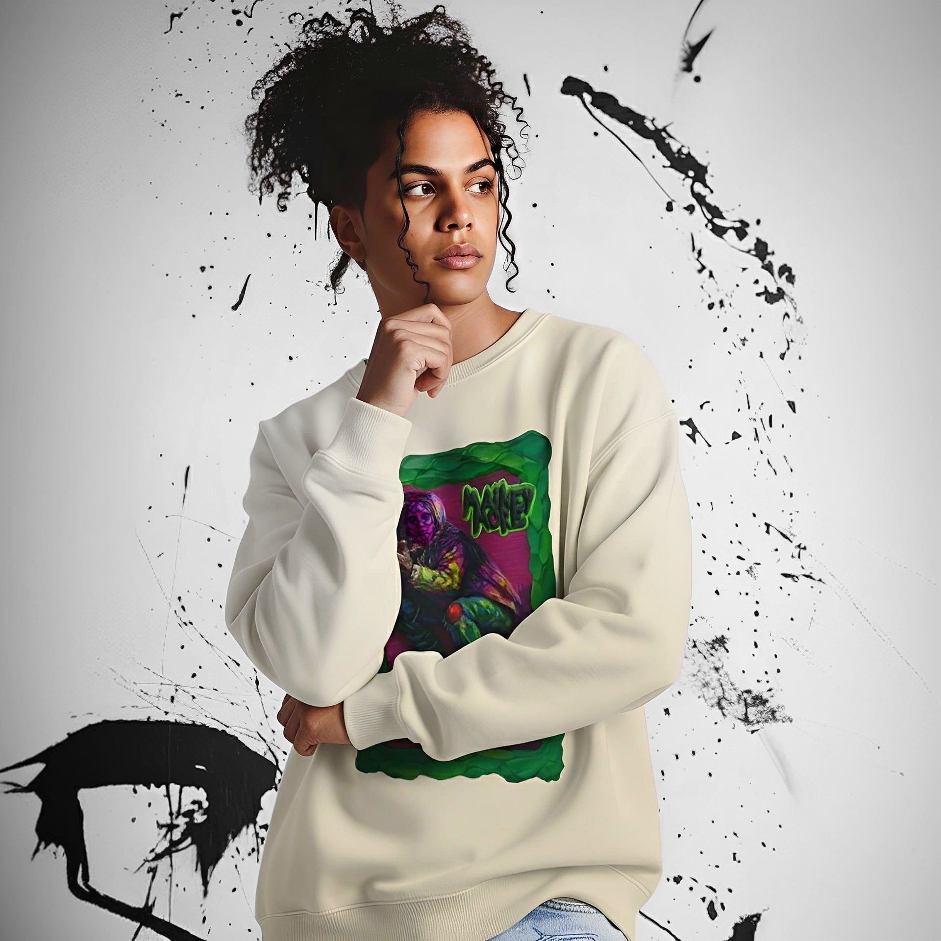 Artfully printed sweatshirt with crouching figure in purple, green and yellow tones, framed by thick green lines