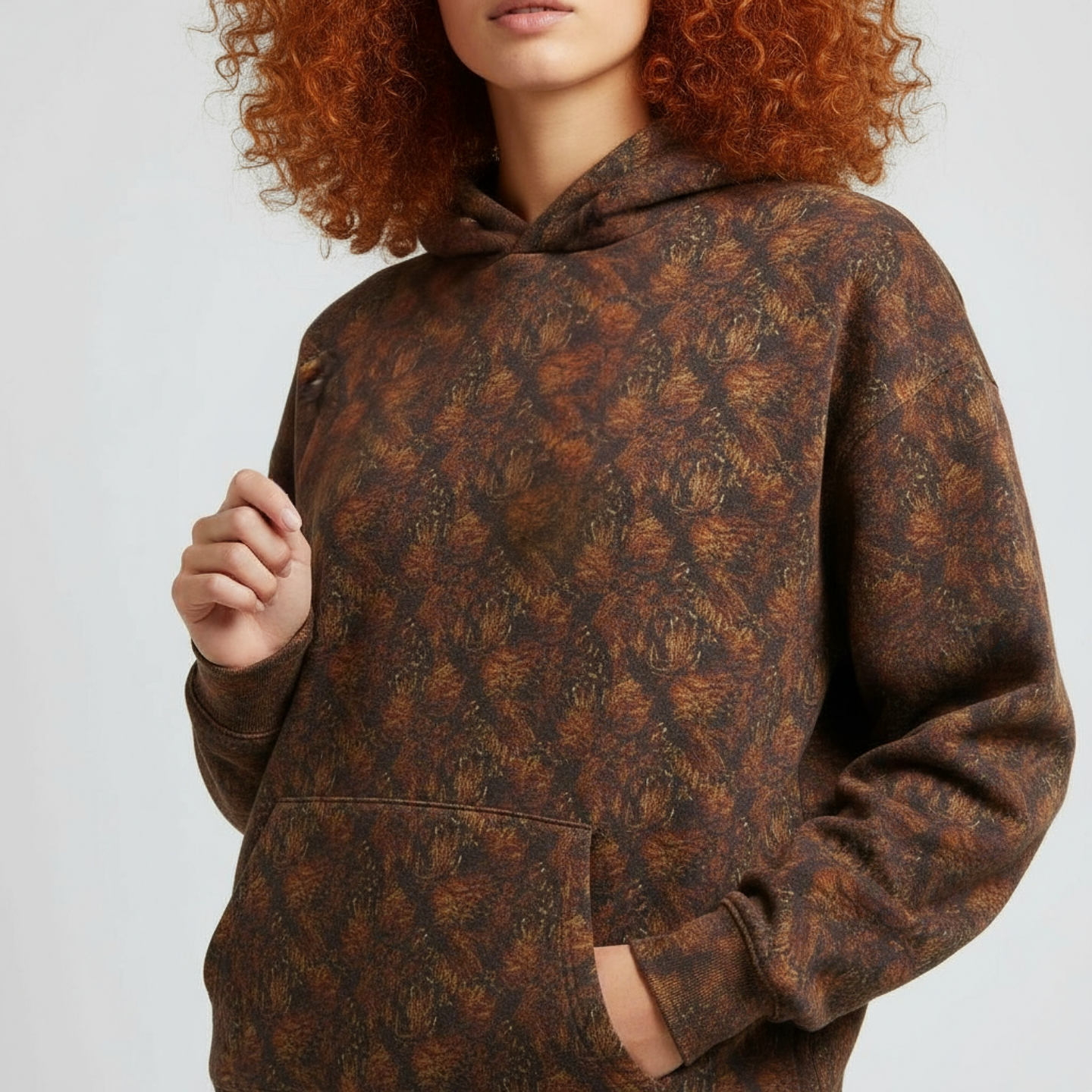Oversized street style hoodie with artistic patina print, popular with the hip hop community