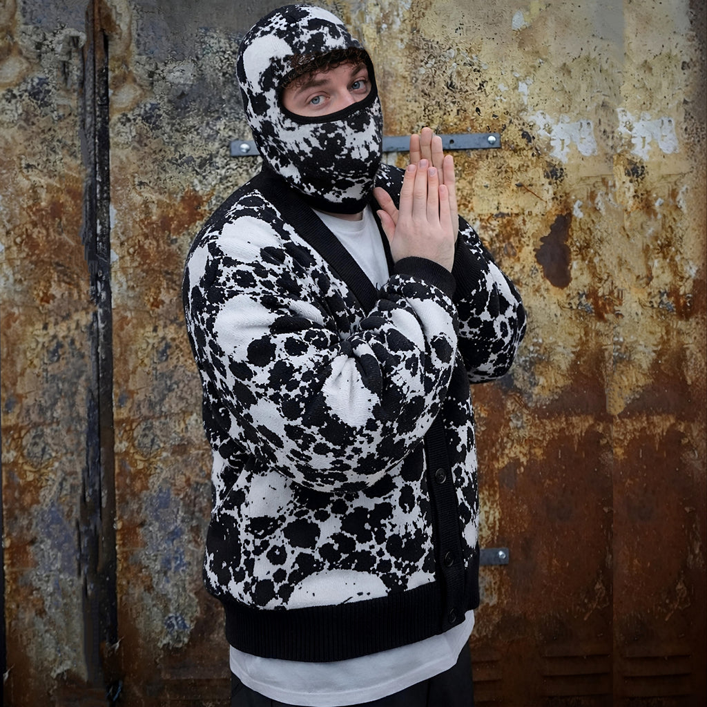 Back of the black and white skull splatter cardigan with the Mainey More lettering woven in red across the shoulders