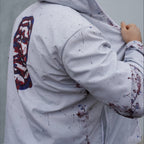 WOUNDED ICONOCLAST UNISEX WINDBREAKER