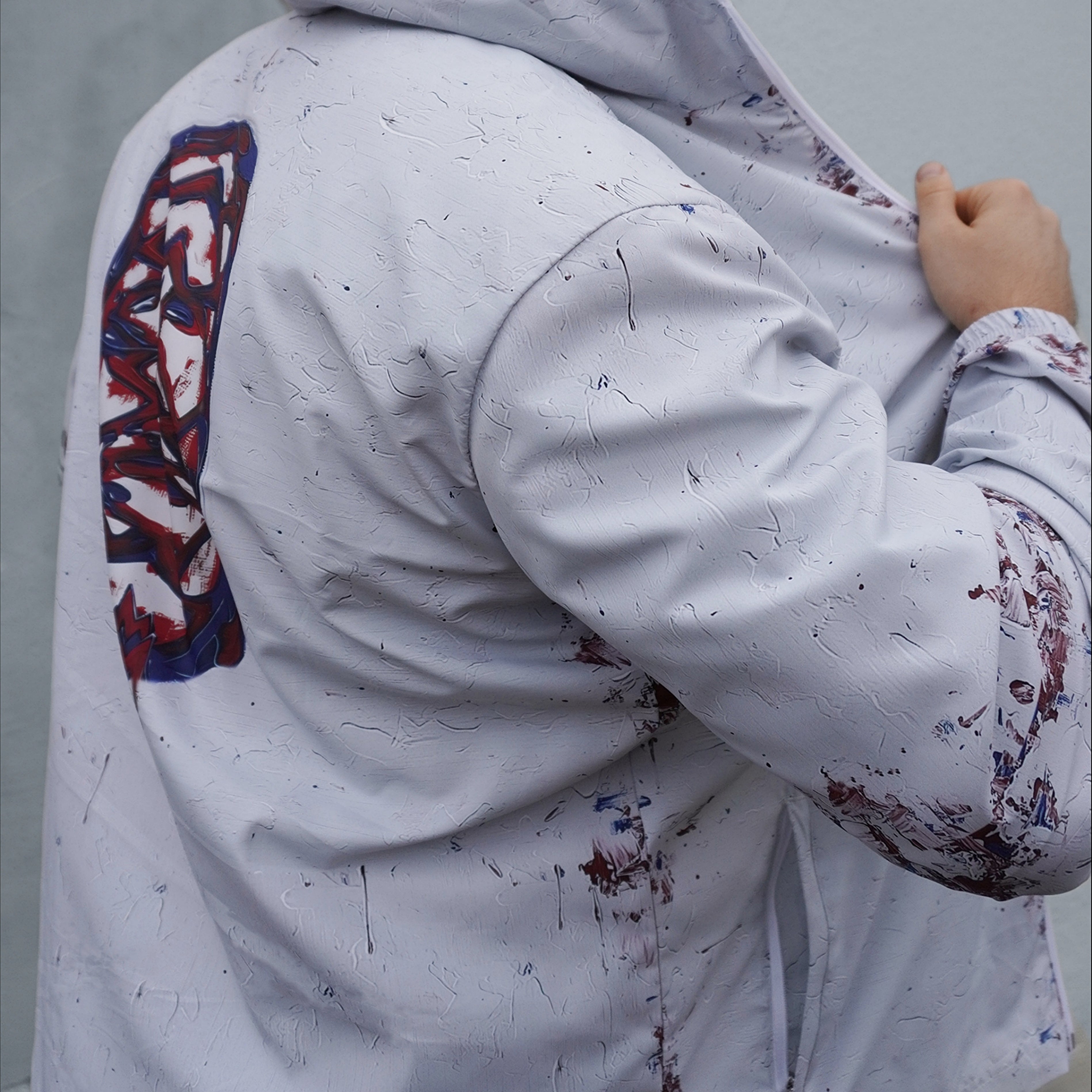 UNISEX WOUNDED ICONOCLAST WINDBREAKER