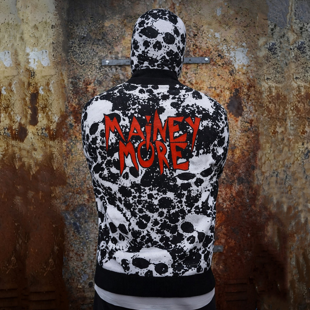 Black and white ink splatter pattern with skulls hidden in it, woven throughout the fabric